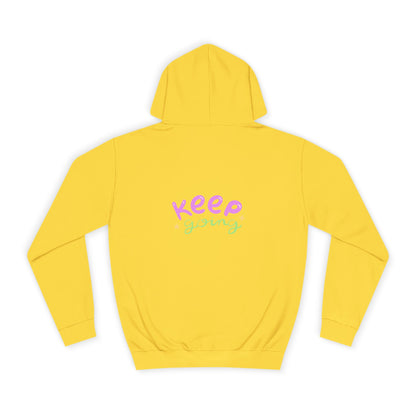 Yellow hoodie with 'Keep Going' text on a white background