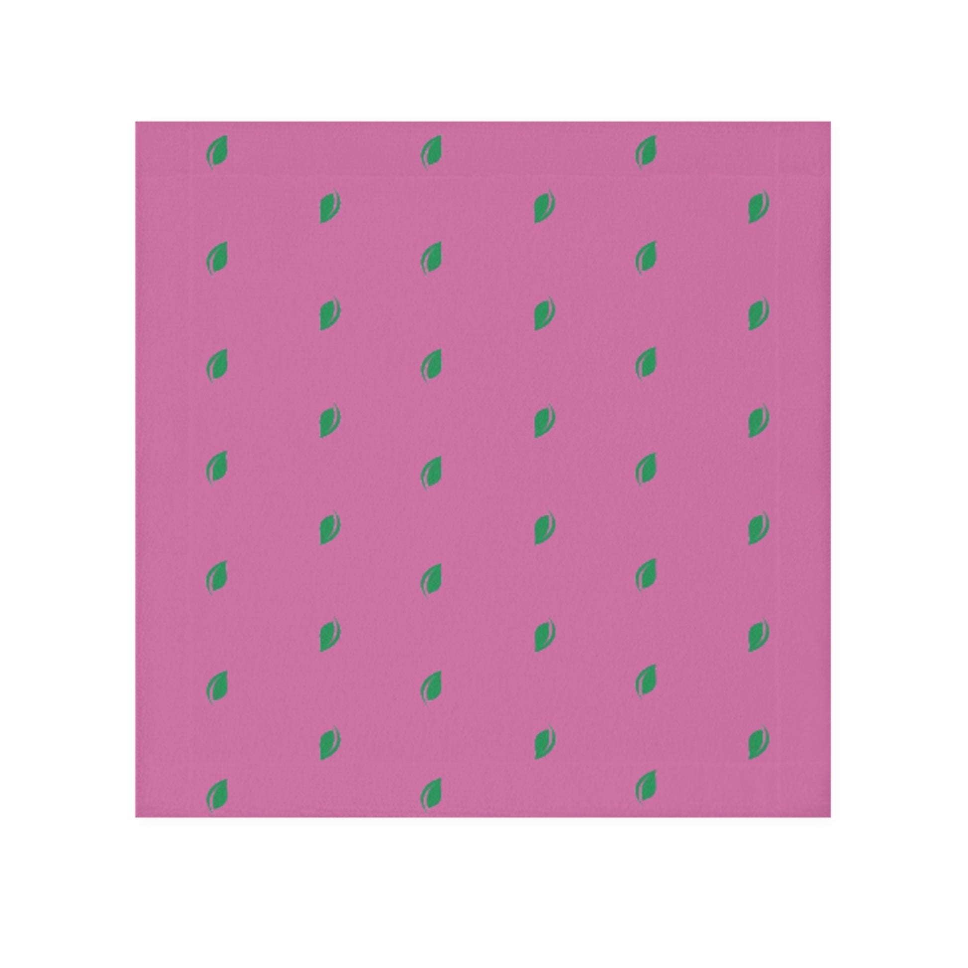 A pink face towel with a pattern of small, green leaf-like shapes distributed evenly over the surface.


