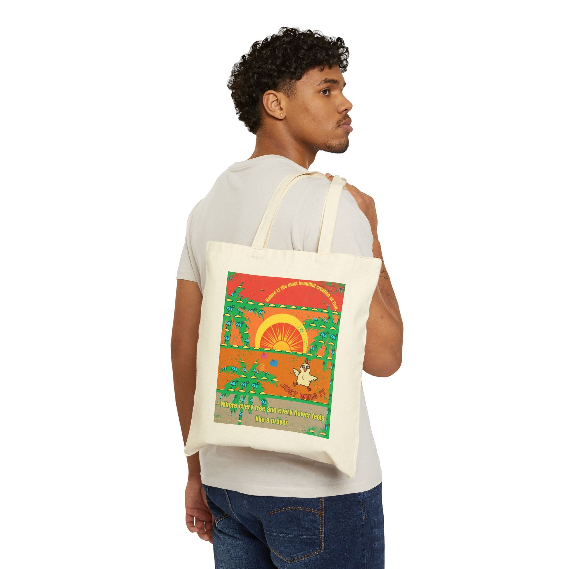 Person carrying a tote bag with a colorful design featuring a sunset and palm trees.