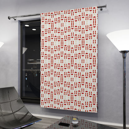 Red and white geometric pattern curtain hanging on window in a modern room

