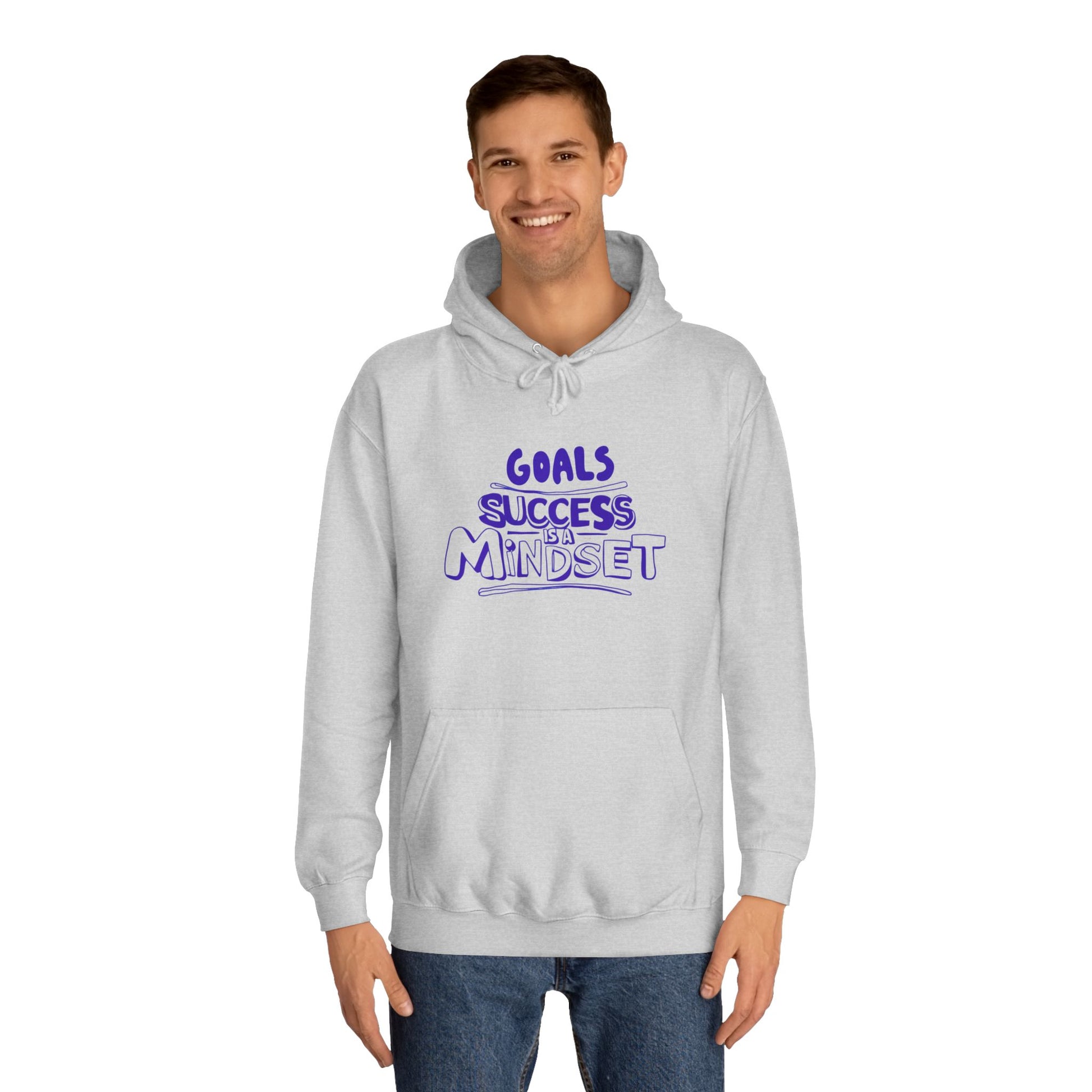 Person wearing a gray hoodie with a motivational quote on a white background