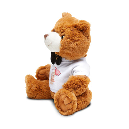 Brown teddy bear wearing a white shirt with a pink heart on a white background