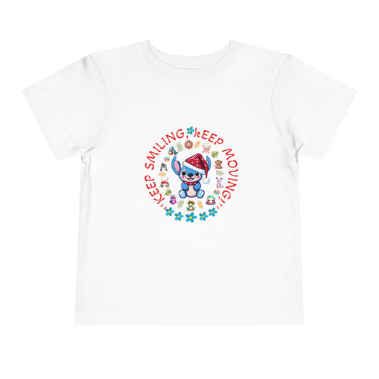 Toddler t-shirt with a cute dog illustration and motivational quote "Keep Smiling Keep Moving" printed in the center.