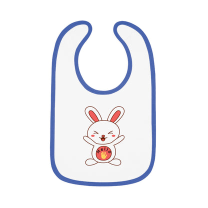 A white baby bib with blue contrast trim and a centered graphic of a smiling cartoon rabbit holding a round object