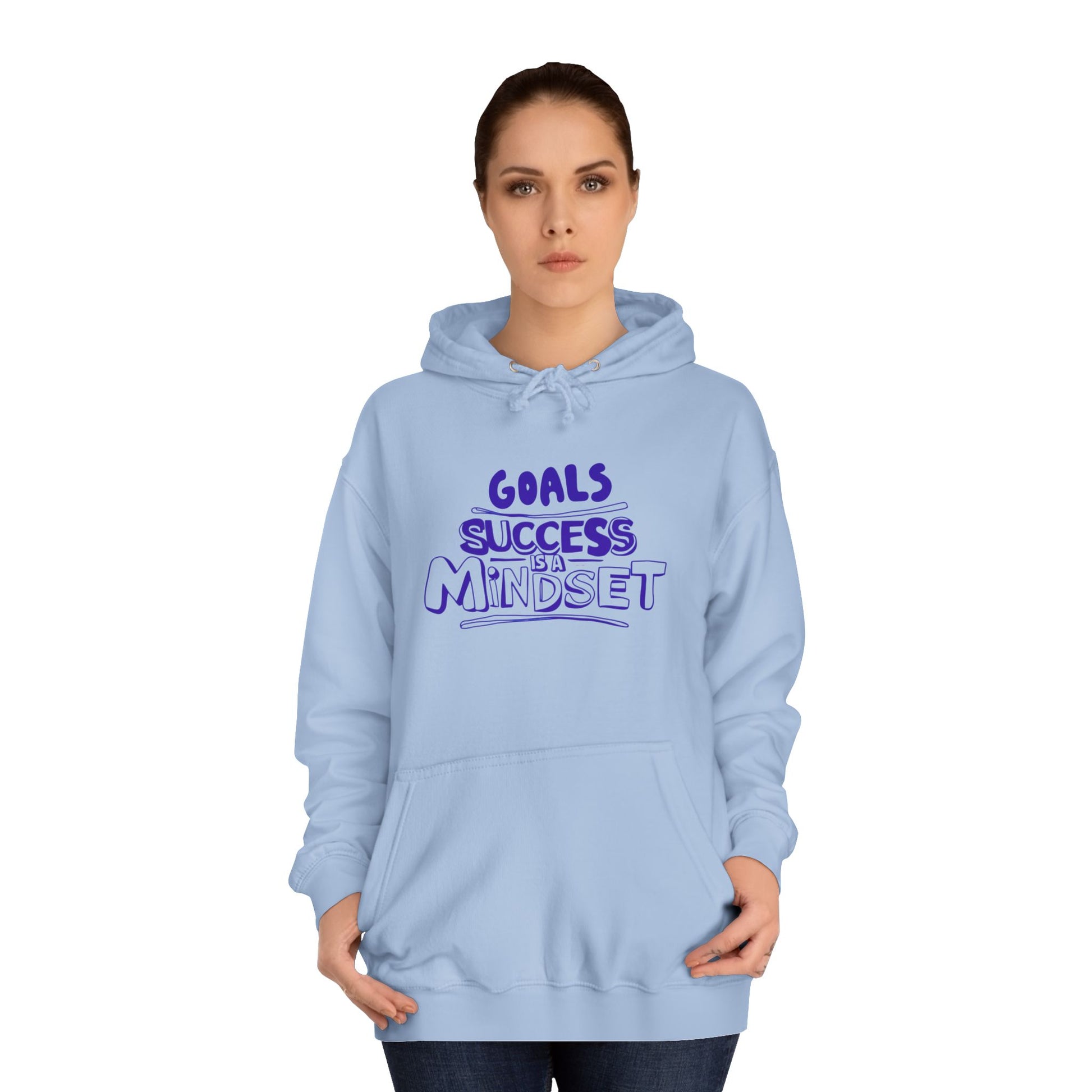 Person wearing a light blue hoodie with a motivational quote.