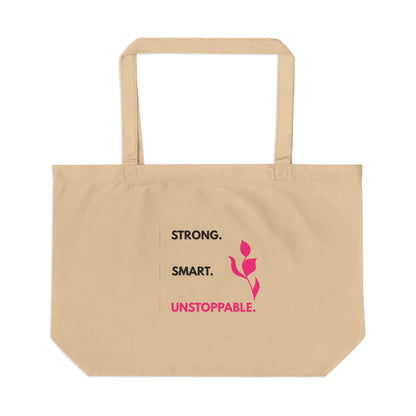 Beige tote bag with motivational text and a pink flower graphic on a white background