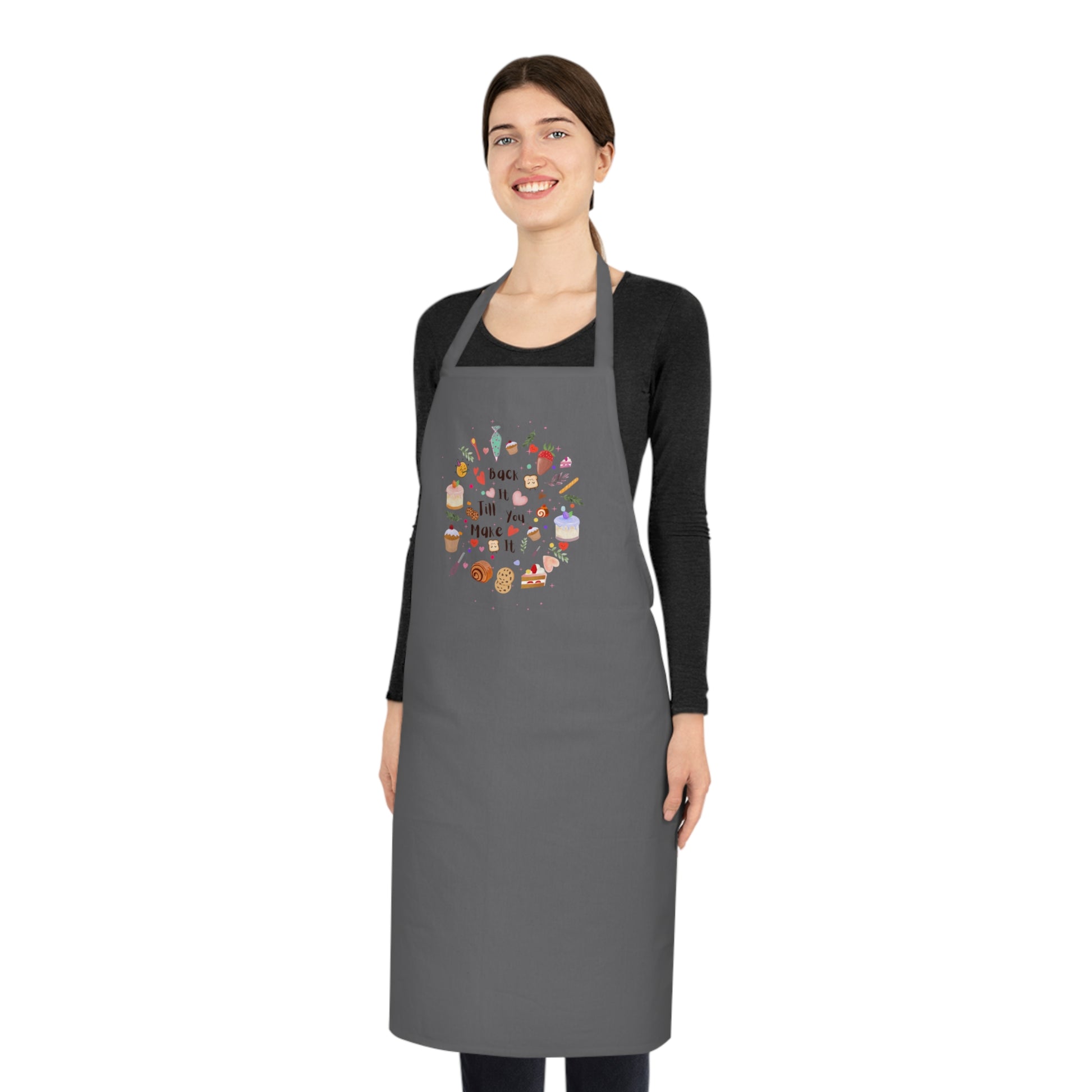 Woman wearing a gray apron with a colorful design on a white background