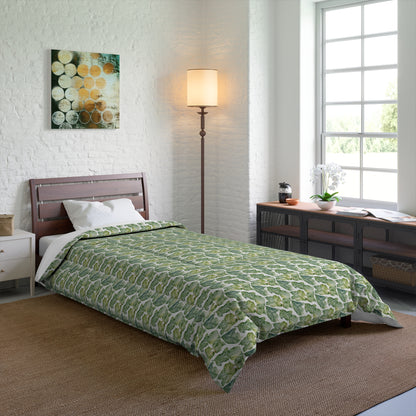 A comforter with a geometric pattern in shades of green and white, displayed against a white background.
