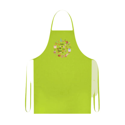 Cotton kitchen apron with "Bake it till you make it" text and circular illustrations of cake, biscuit, cone, and baking utensils.

