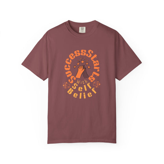 Maroon t-shirt with motivational graphic and text on a white background