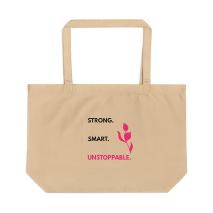 Beige tote bag with motivational text and a pink flower design on a white background
