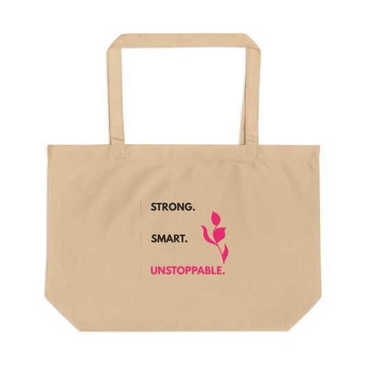 Beige tote bag with motivational text and a pink flower design on a white background