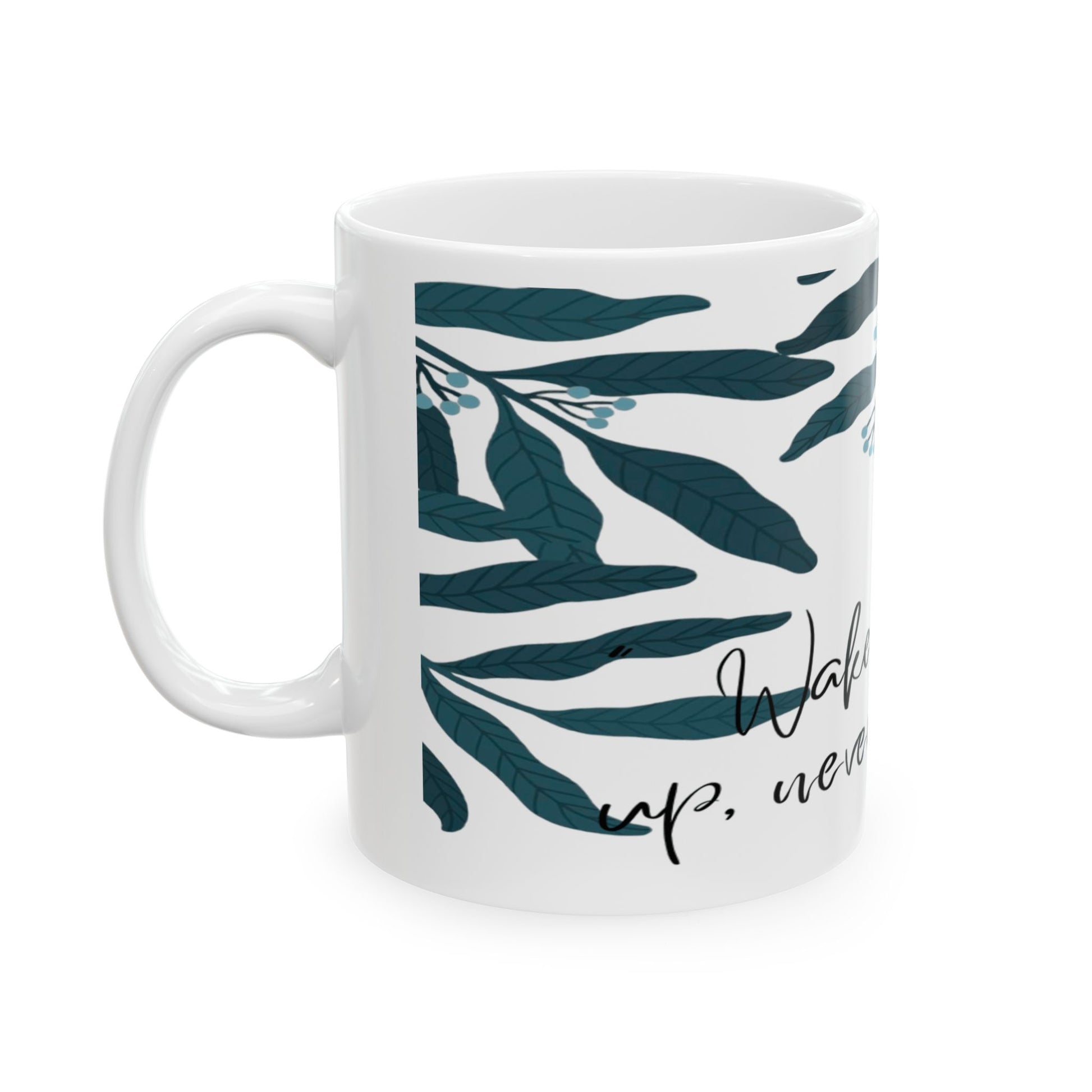 White mug with green leaf pattern and text on a white background
