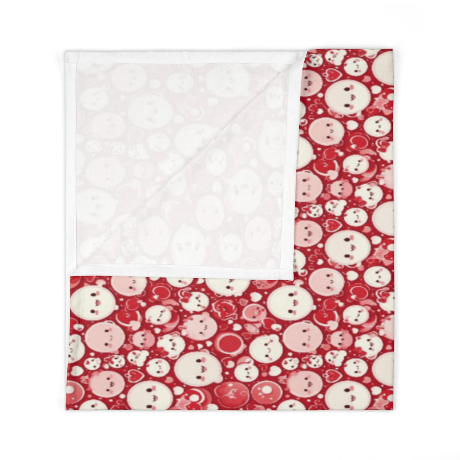 Quilt with red and white snowman pattern on a white background