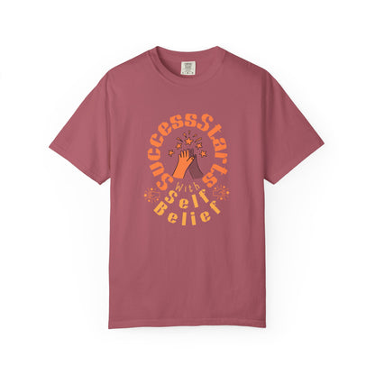Maroon t-shirt with motivational text and design on a white background