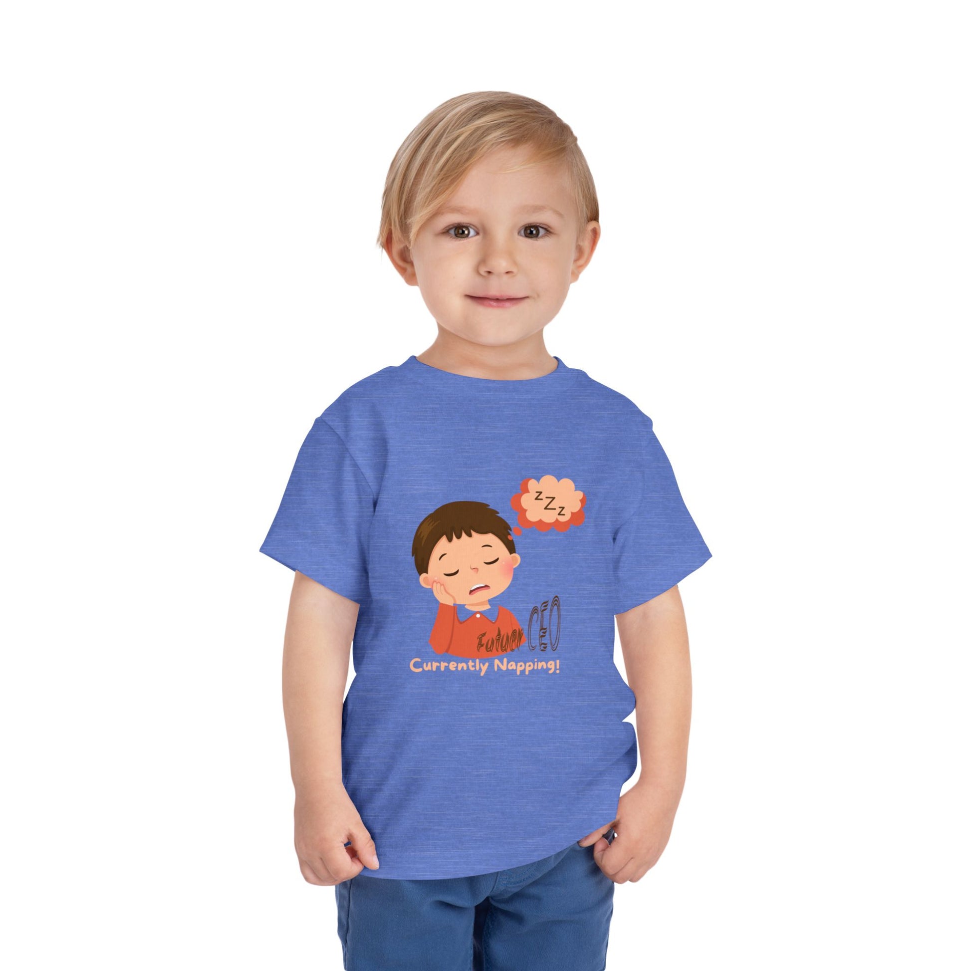 Child wearing a blue t-shirt with a cartoon character and text on a white background