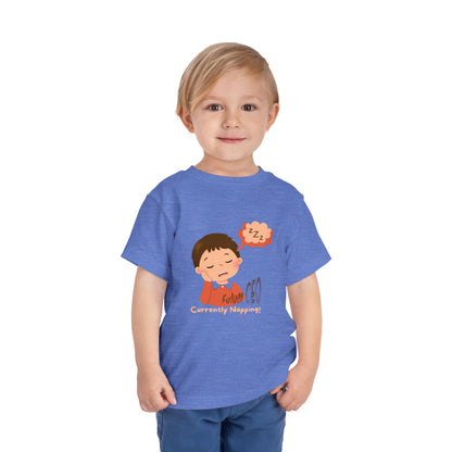 Child wearing a blue t-shirt with a cartoon character and text on a white background