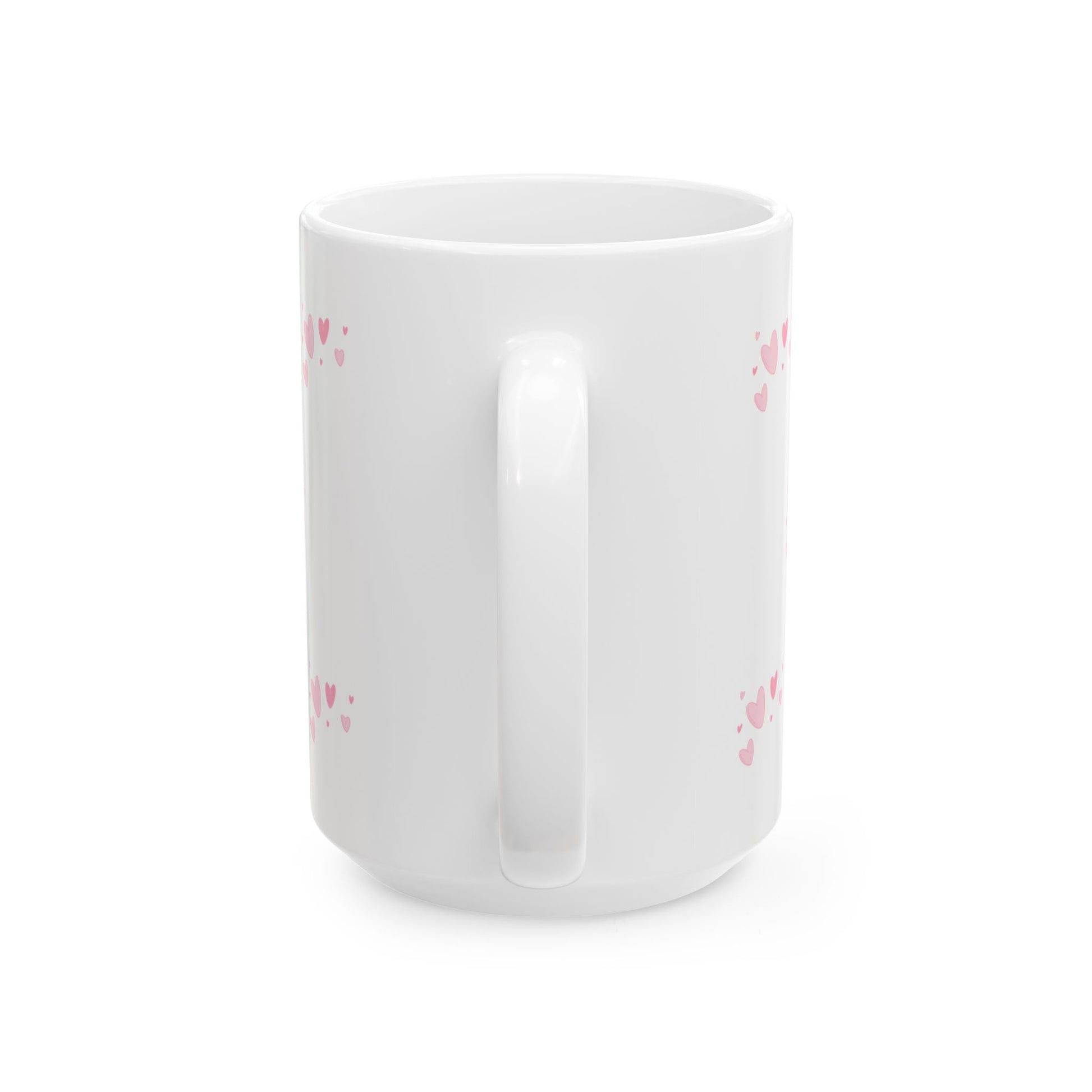 White mug with pink heart patterns on a white background