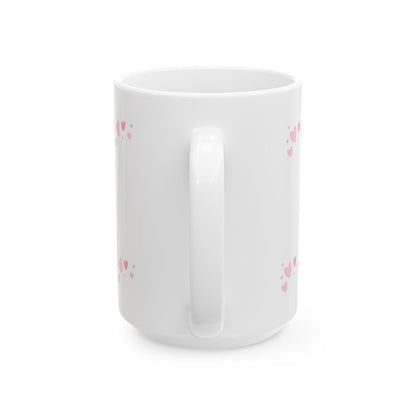 White mug with pink heart patterns on a white background