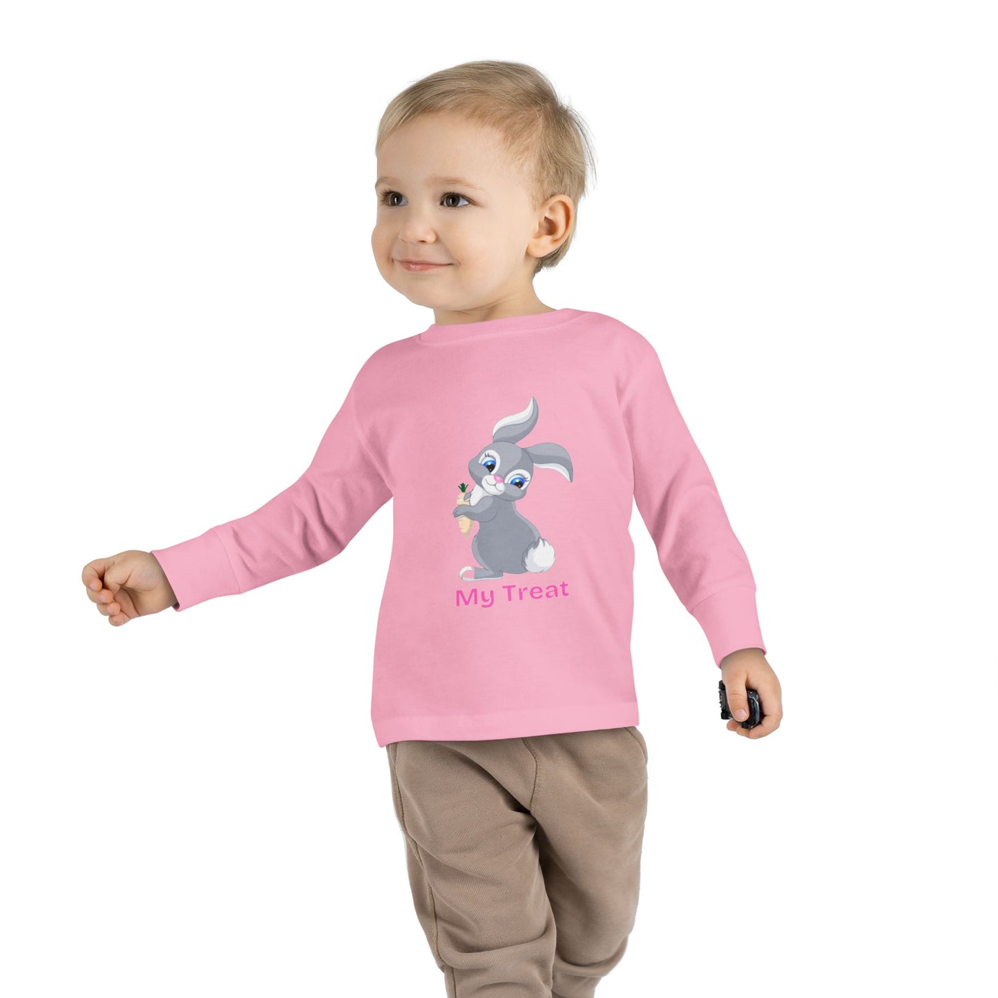 Child wearing a pink long-sleeve shirt with a cartoon character on a white background